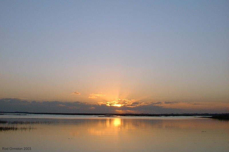 Sunset over the marshes east of the Lymington River, January 2003.