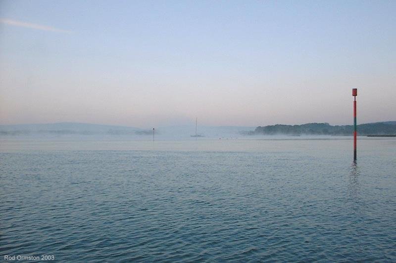 Morning mist clearing on the Newtown River, Isle of Wight in October 2003.