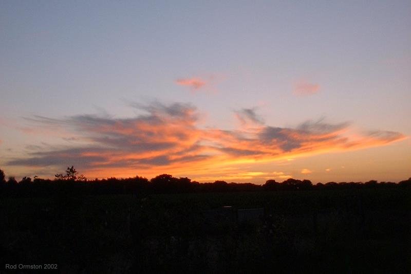 Sunset over the fields near Lepe, Hampshire, August 2002.